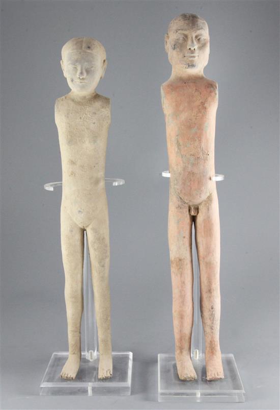 Two tall Chinese pottery stick figures of men, Han dynasty (206BC - 220AD) 56cm and 60cm, modern stands